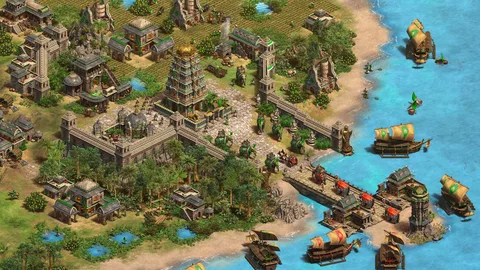 Captura Age Of Empires II Definitive Edition – Ciudad Costera Amurallada Con Templos Cultivos Y Barcos Atracando En La Playa