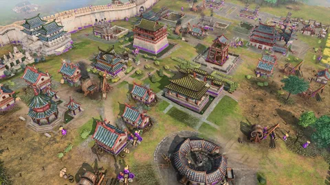 Captura Age Of Empires IV Anniversary Edition – Ciudad Amurallada De Arquitectura Oriental Con Estructuras Militares Y Aldeanos Caminando