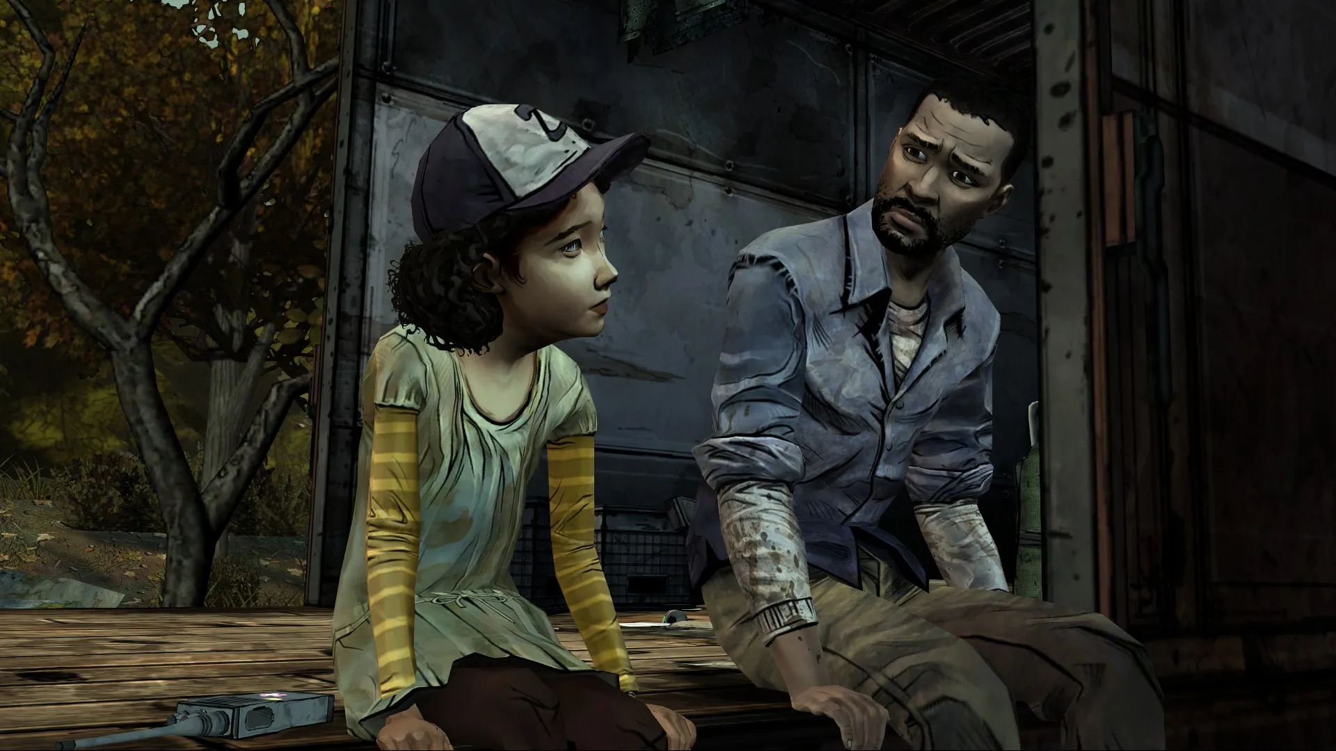 Captura Dead Season – Hombre Y Nina Sentados Con Expresion Triste En Entorno Boscoso