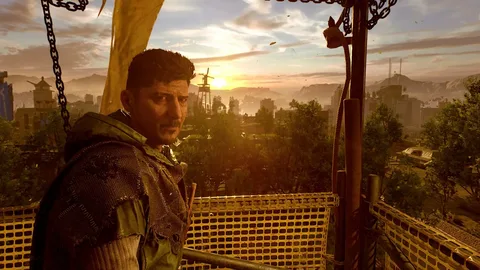 Captura Dying Light 2 Stay Human Hombre Con Expresion Seria En Un Mirador Elevado Con La Ciudad Al Fondo Al Atardecer