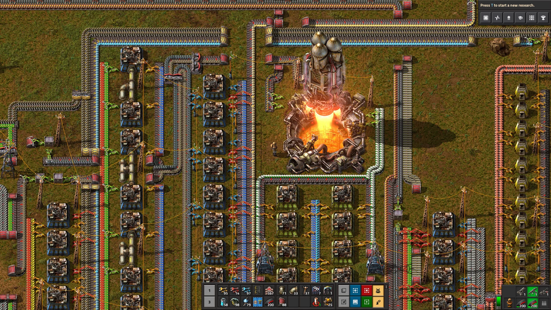 Captura Factorio – Centro Industrial Con Reactor Activo Rodeado De Lineas De Ensamblaje Y Energia