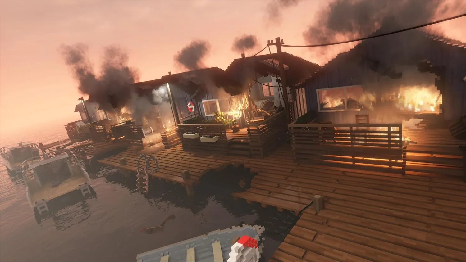 Captura Teardown – Casas Flotantes Envueltas En Llamas Y Humo Negro Sobre Un Muelle Al Atardecer