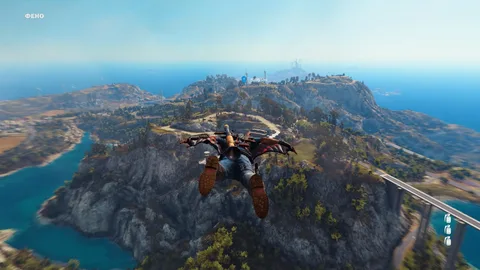 Captura Just Cause 3 – Protagonista Planea Sobre Una Isla Montanosa Desde Lo Alto