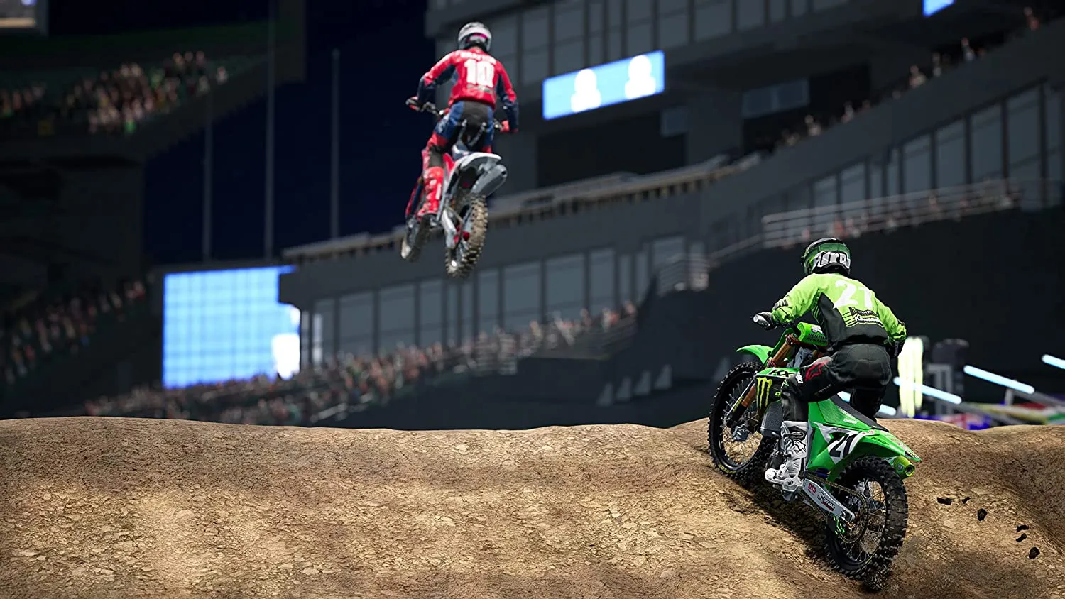Captura Monster Energy Supercross Un Motociclista Salta Por Una Rampa Mientras Otro Lo Sigue Desde Atras