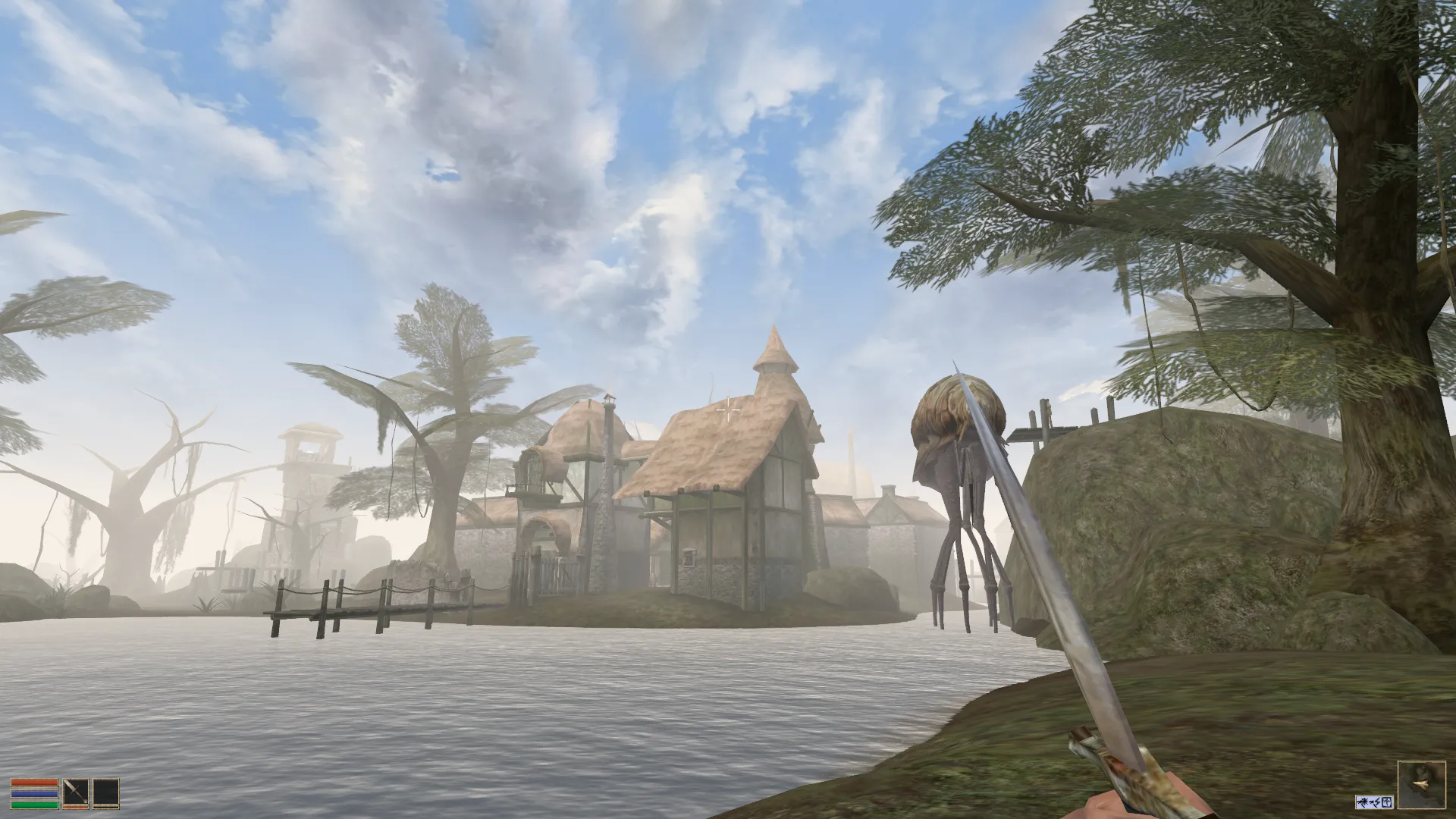 Captura The Elder Scrolls III Morrowind – Vista De Un Lago Con Criaturas Caminando Entre Arboles Y Casas De Madera